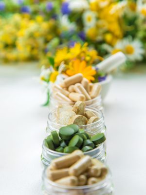 Supplements and vitamins with medicinal herbs. Selective focus. Nature.